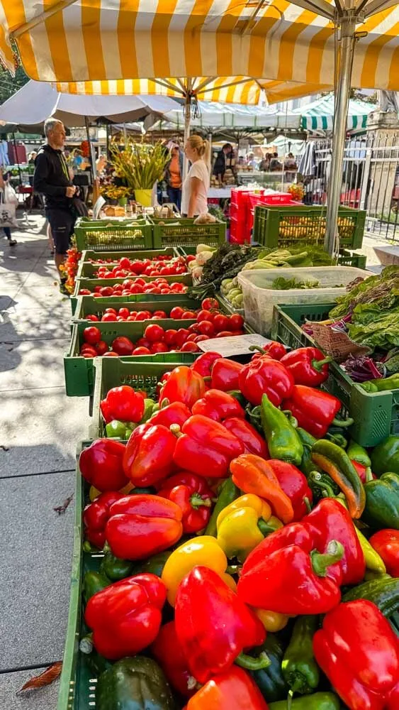 Bell peppers and other veggies at a farmers market in Graz